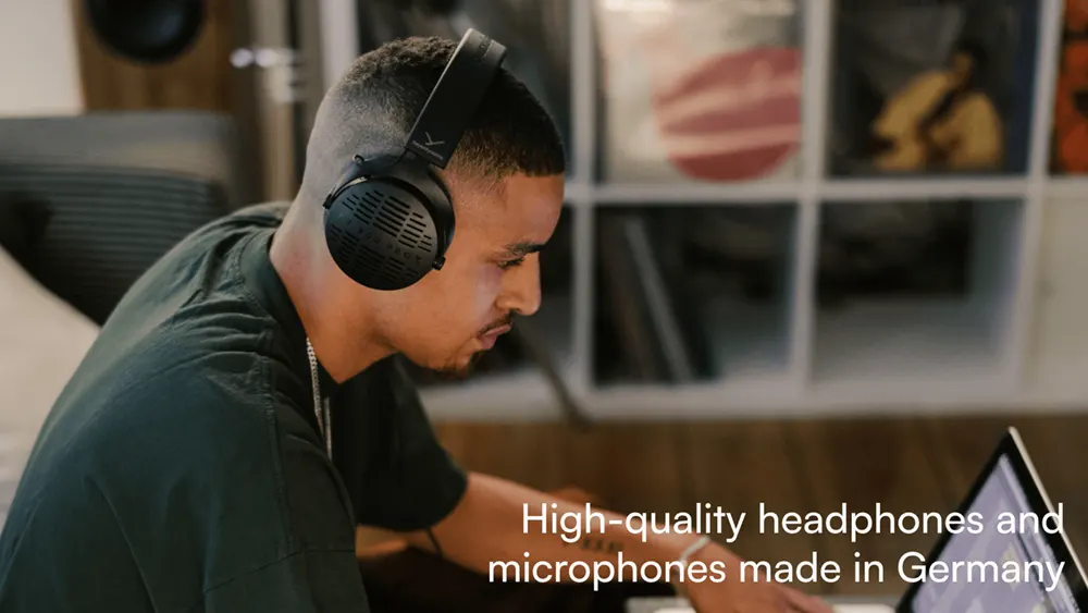 Men enjoying music through Beyerdynamic headphones while focused on their laptops