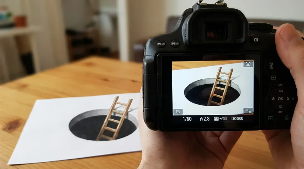 How to photograph an anamorphic art tutorial drawing for the best effect.